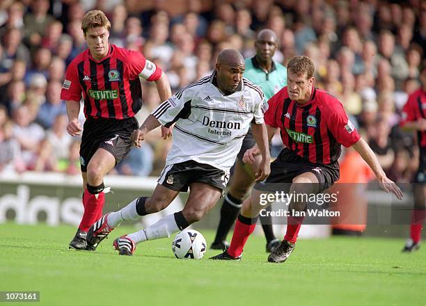 Barry Hayles of Fulham runs with the ball while being watched by Gary Flitcroft and Craig Short of Blackburn Rovers during the Nationwide League...