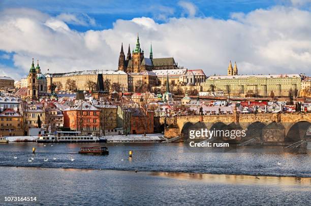 view of prague and charles bridge at winter - prague st vitus stock pictures, royalty-free photos & images