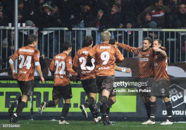 Players of Hamburg celebrate after Christian Tiffert of Kaiserslautern scored an own goal during the Bundesliga match between FC St. Pauli and 1. FC...