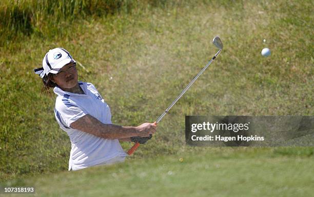 Caryn Khoo of Auckland plays out of a bunker at the 12th hole during the semi-finals on the final day of the Women's Interprovincial Golf...