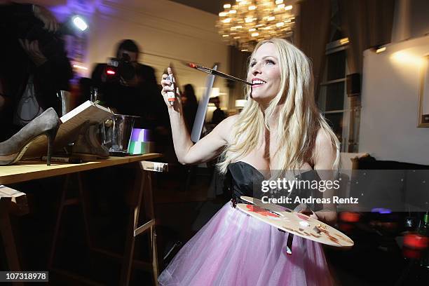 Sonya Kraus paints during the 'Movie meets Media' - Night at Hotel Atlantic on December 3, 2010 in Hamburg, Germany.