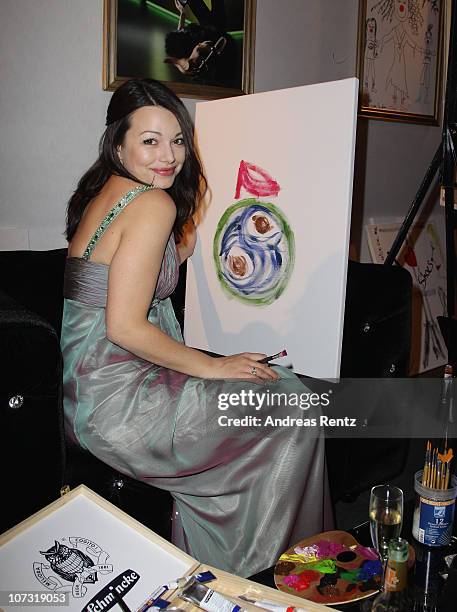 Cosma Shiva Hagen paints during the 'Movie meets Media' - Night at Hotel Atlantic on December 3, 2010 in Hamburg, Germany.