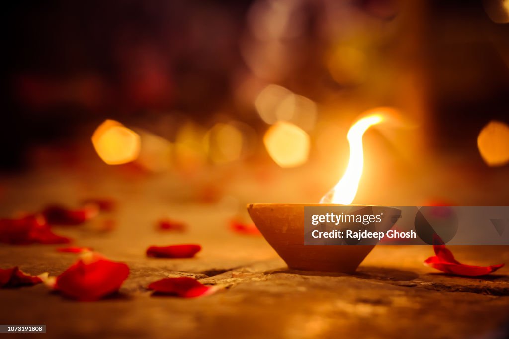 Diwali lamps and rose petals