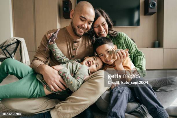 best part of being at home - four people stock pictures, royalty-free photos & images