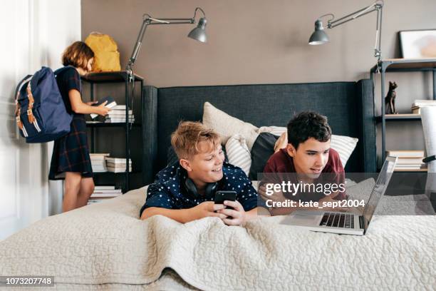 teens working on school project at home - busy schedule stock pictures, royalty-free photos & images