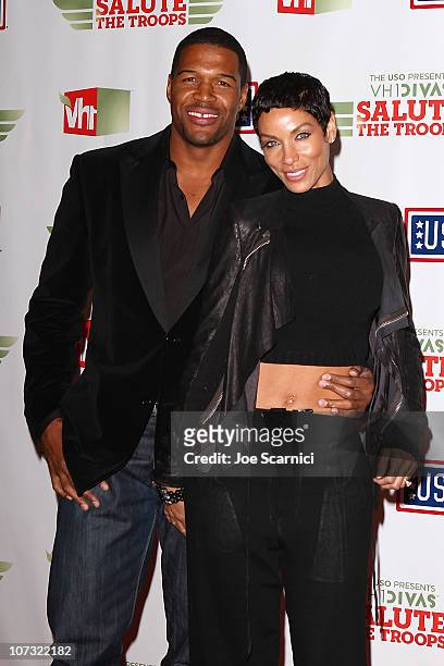 Michael Strahan poses with his wife Nicole Murphy at The USO Presents "VH1 Divas Salute The Troops" at Marine Corps Air Station Miramar on December...
