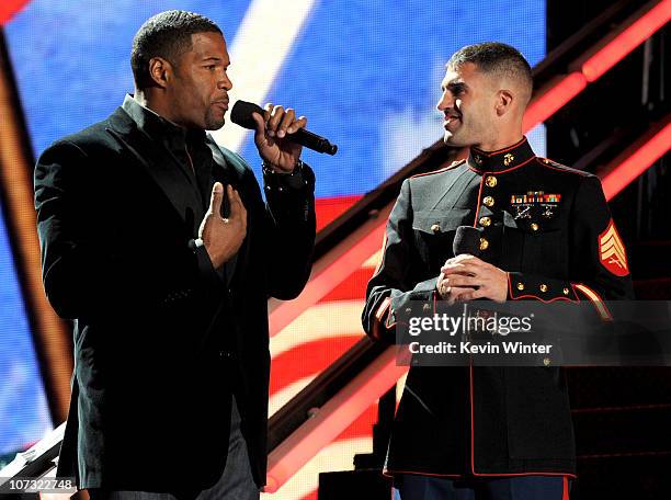 Former NFL player Michael Strahan speaks onstage during "VH1 Divas Salute the Troops" presented by the USO at the MCAS Miramar on December 3, 2010 in...