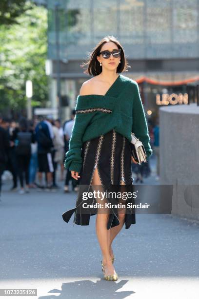 Fashion director at Instagram Eva Cheng wears a Christopher Kane dress, Alexander Mcqueen sunglasses, M2malletier bag and Kalda shoes during London...