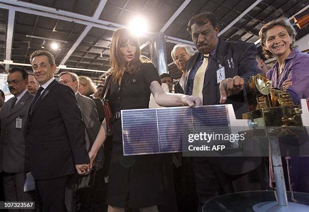 French president Nicolas Sarkozy and his wife Carla Bruni-Sarkozy visit a satellite exhibition at the Indian Space Research Organization in Bangalore...