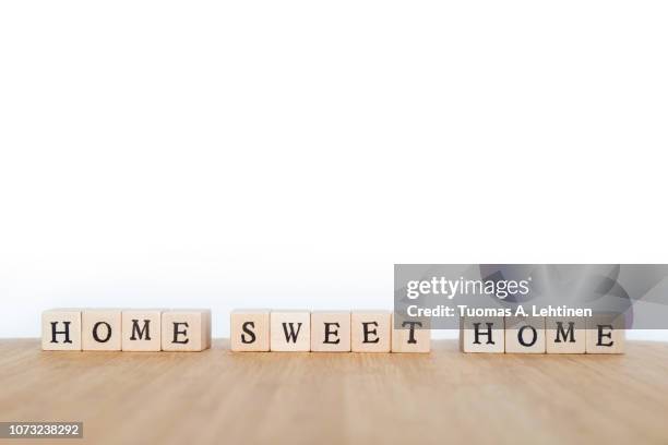 phrase made of wooden dice - home sweet home stock pictures, royalty-free photos & images