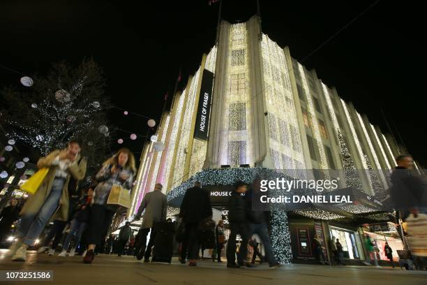 Christmas decorations around the House of Fraser department store are seen on Oxford street in central London on December 13, 2018.