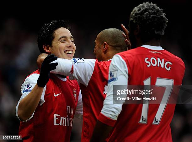 Samir Nasri of Arsenal is congratulated by teammates after scoring the opening goal during the Barclays Premier League match between Arsenal and...
