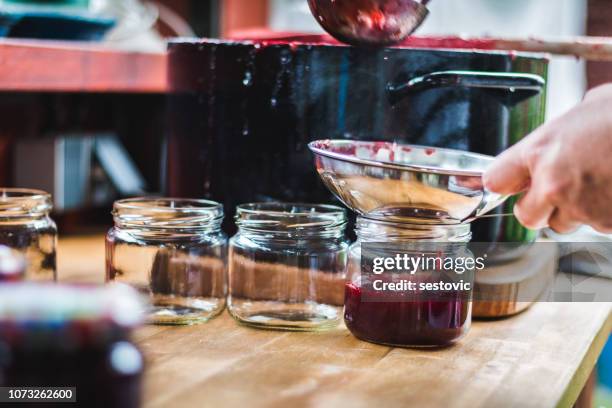 making homemade jam - strawberry jam stock pictures, royalty-free photos & images