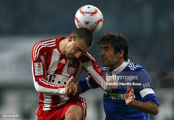 Raul of Schalke and Diego Contento of Bayern Muenchen head for the ball during the Bundesliga match between FC Schalke 04 and Bayern Muenchen at...