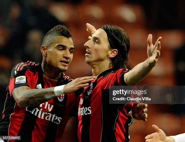 Zlatan Ibrahimovic and Kevin Prince Boateng of AC Milan celebrate scoring the third goal during the Serie A match between Milan and Brescia at Stadio...