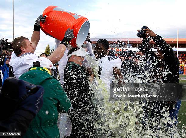 Head Coach Chip Kelly of the Oregon Ducks laughs with Drew Davis after having Gatorade dumped on him after the 37-20 victory over the Oregon State...