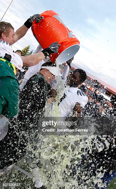 Head Coach Chip Kelly of the Oregon Ducks laughs with Drew Davis after having Gatorade dumped on him after the 37-20 victory over the Oregon State...