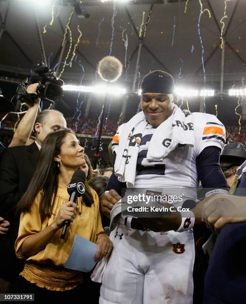 Sideline reporter Tracy Wolfson waits for an interview as quarterback Cam Newton of the Auburn Tigers celebrates after their 56-17 win over the South...
