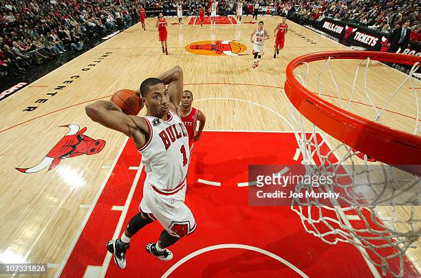 Derrick Rose of the Chicago Bulls goes for a dunk during the NBA game against the Houston Rockets on December 4, 2010 at the United Center in...