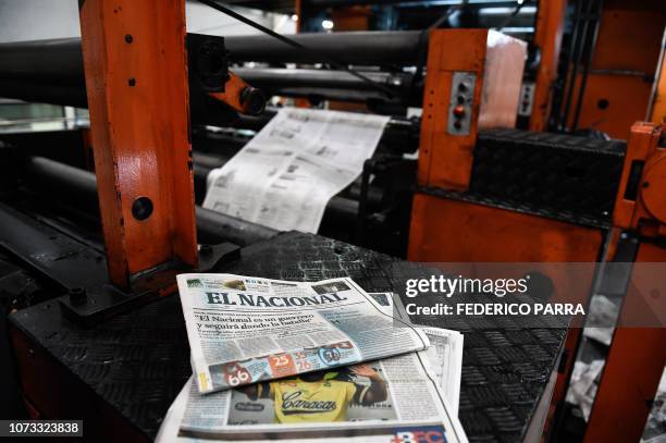 View of the front page of Venezuelan newspaper El Nacional last edition with a headline reading "El Nacional is a worrior and will keep on fighting"...