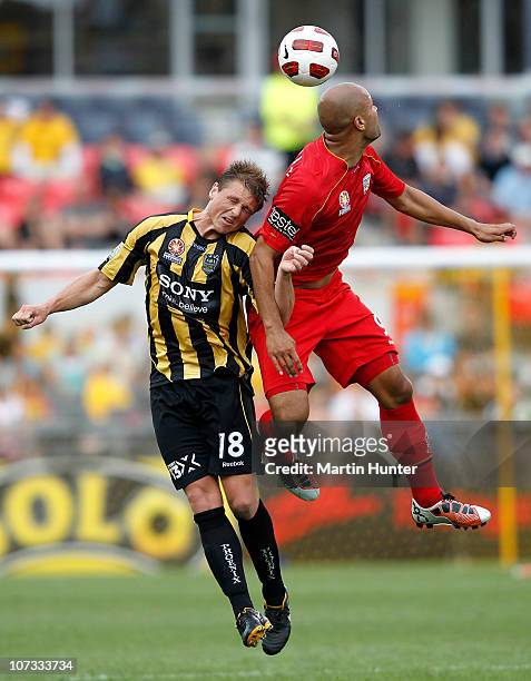 Ben Sigmund of the Phoenix and Sergio van Dijk of Adelaide United contest for the ball during the round 17 A-League match between the Wellington...