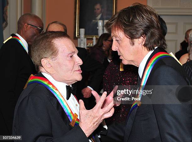 Kennedy Center honorees Jerry Herman, left, and Sir Paul McCartney, right, share some thoughts after posing for their formal class photo following...
