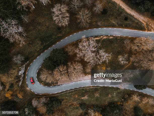 countryside road in autumn as seen from above - hairpin curve stock pictures, royalty-free photos & images