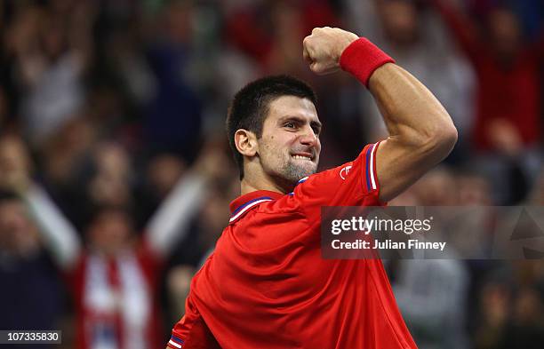 Novak Djokovic of Serbia celebrates winning a game in his match against Gael Monfils of France during day three of the Davis Cup Tennis Final at the...