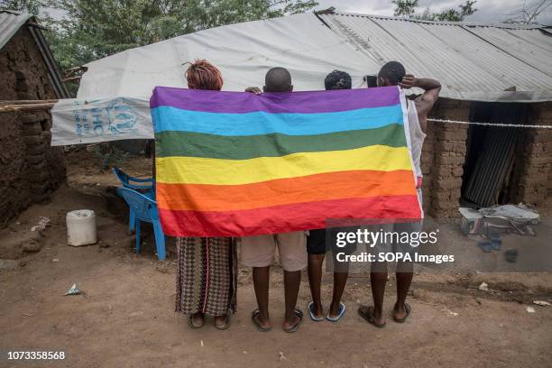 Ugandan LGBT refugees pose in a protected section of Kakuma refugee camp in northwest Kenya. They fled Uganda following the anti-gay law brought in...