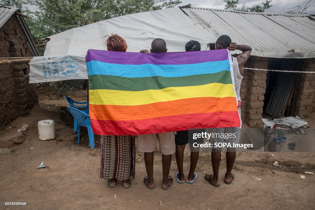 Ugandan LGBT refugees pose in a protected section of Kakuma...