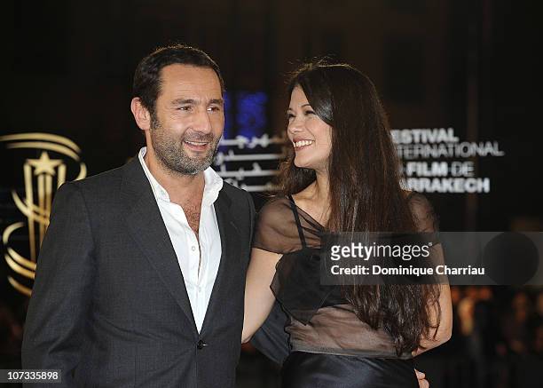 Actor Philippe Lelouche and actress Melanie Doutey attend the Tribute to the French Cinema during the 10 th Marrakech Film Festival on December 4,...