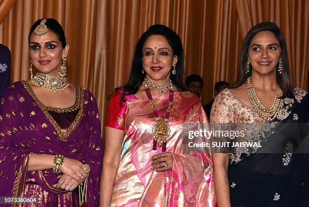 Indian Bollywood actress Hema Malini with daughters Esha Deol and Ahana Deol attend the wedding reception of Isha Ambani, whose father is tycoon...