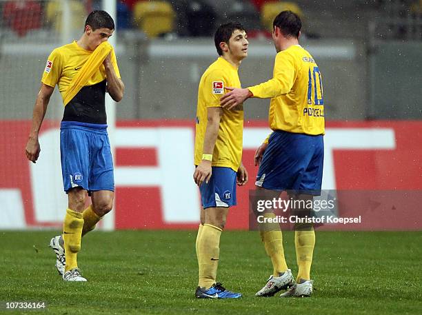 Stefan Mueller, Matthias Zimmermann and Massimilian Porcello of Karlsruhe look dejected after losing 0-1 the Second Bundesliga match between Fortuna...