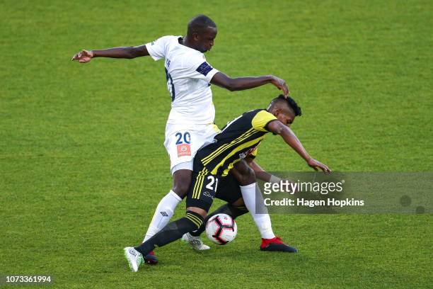 Roy Krishna of the Phoenix is tackled by Kalifa Cisse of the Mariners during the round eight A-League match between the Wellington Phoenix and the...