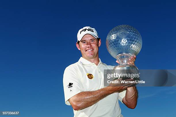 Lee Westwood of England poses with the trophy after winning the 2010 Nedbank Golf Challenge at the Gary Player Country Club Course on December 5,...