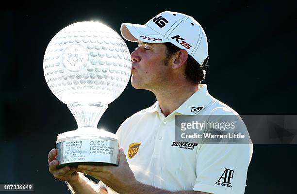 Lee Westwood of England poses with the trophy after winning the 2010 Nedbank Golf Challenge at the Gary Player Country Club Course on December 5,...