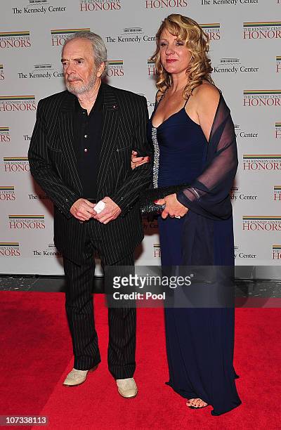 Merle Haggard, one of the 2010 Kennedy Center honorees, arrives with his wife, Theresa Ann Lane, for the formal artist's dinner for the Kennedy...