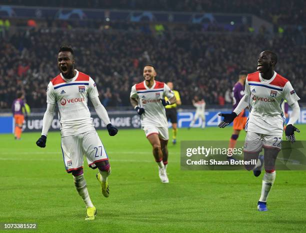 Maxwell Cornet of Olympique Lyonnais celebrates after scoring the first goal during the UEFA Champions League Group F match between Olympique...