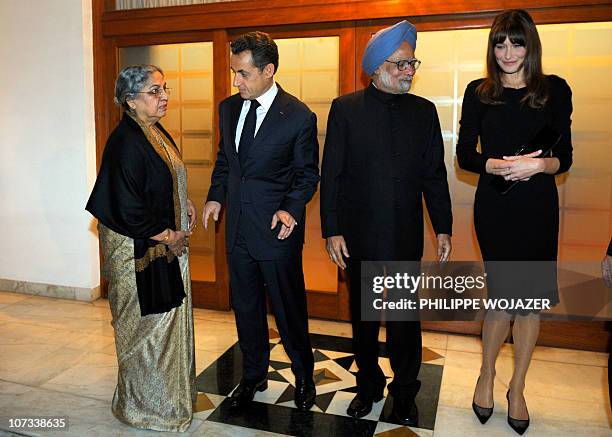 Indian Prime Minister Manmohan Singh and his wife Gursharan Kaur , France's President Nicolas Sarkozy and his wife Carla Bruni-Sarkozy prepare for an...