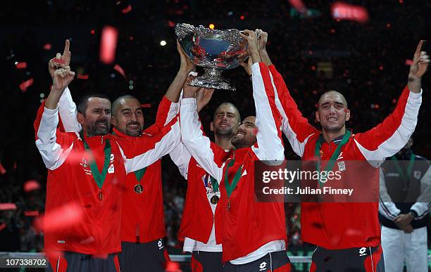 Bogdan Obradovic, Nenad Zimonjic, Novak Djokovic, Janko Tipsarevic and Viktor Troicki of Serbia celebrate with the trophy after defeating France...