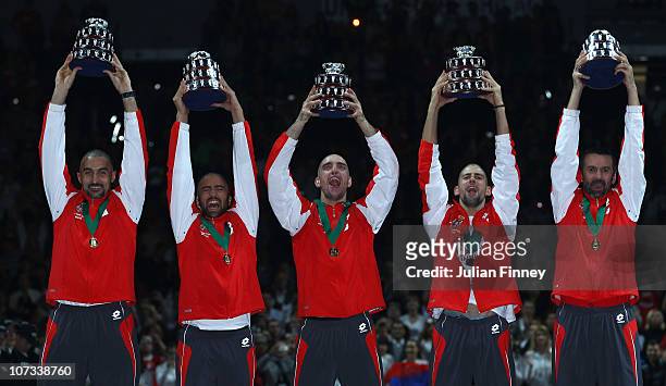 Nenad Zimonjic, Janko Tipsarevic, Viktor Troicki, Novak Djokovic, Bogdan Obradovic of Serbia celebrate with their trophies after defeating France...