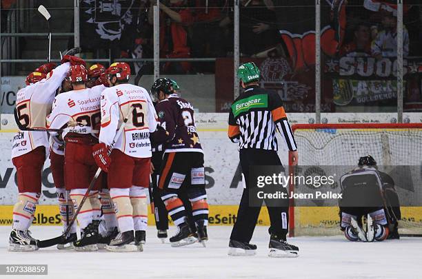 The team of Hannover celebrates after Marvin Krueger scored his team's first goal during the DEL match between Grizzly Adams Wolfsburg and Hannover...