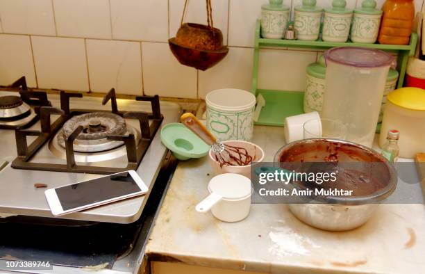 using cell phone in kitchen for recipes - folding phone stock pictures, royalty-free photos & images