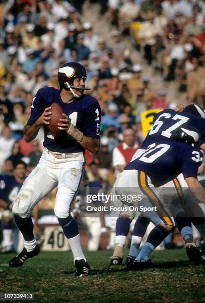 Quarterback Joe Kapp of the Minnesota Vikings drops back to pass during an NFL football game at Metropolitan Stadium circa 1969 in Minneapolis,...