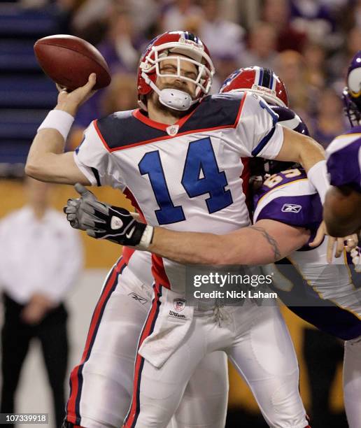 Jared Allen of the Minnesota Vikings sacks Ryan Fitzpatrick of the Buffalo Bills at the Mall of America Field at the Hubert H. Humphrey Metrodome on...