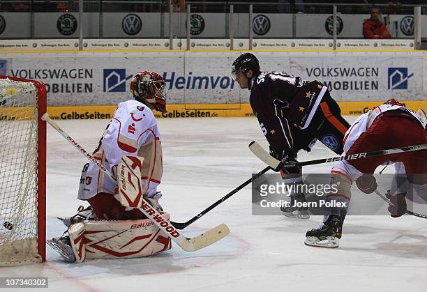 John Laliberte of Wolfsburg scores his team's eights goal during the DEL match between Grizzly Adams Wolfsburg and Hannover Scorpions at the...