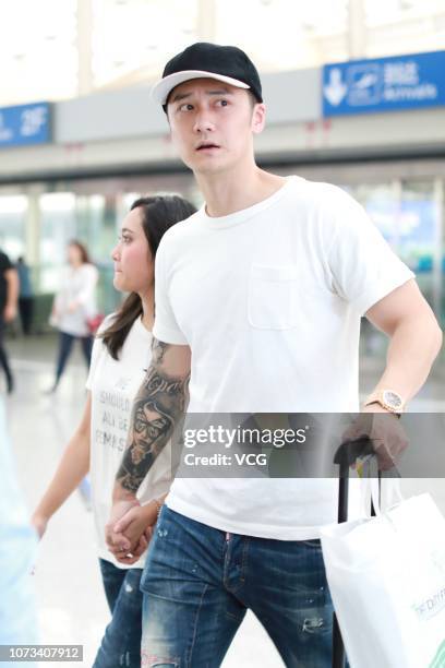Japanese model Haruka Nakaura and Chinese actor Jiang Jinfu arrive at Beijing Capital International Airport on September 13, 2018 in Beijing, China.