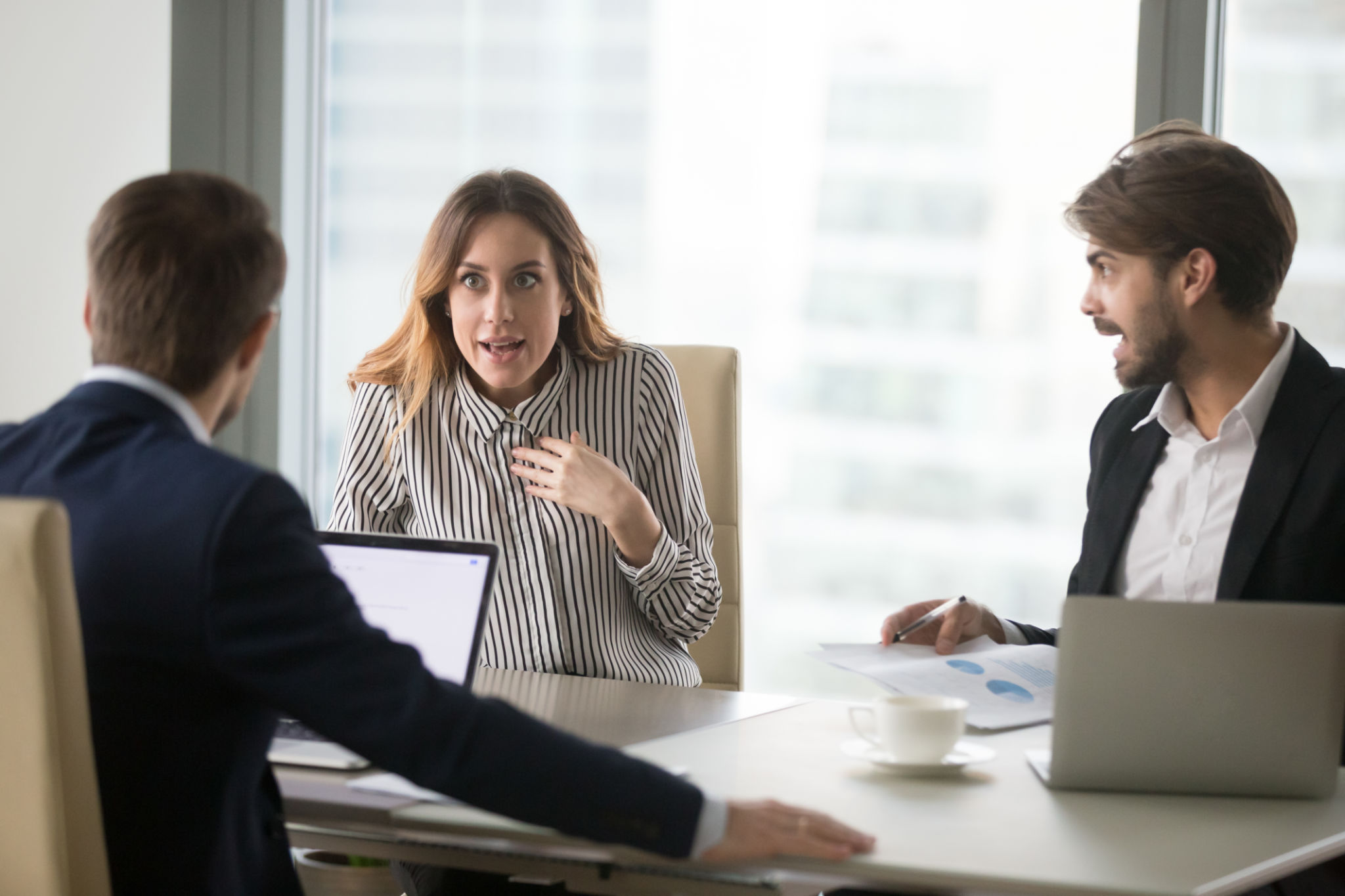 Angry man shouting at indignant female colleague. Angry man shouting at indignant female colleague.