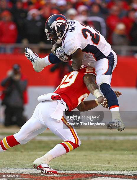 Running back Knowshon Moreno of the Denver Broncos leaps over safety Eric Berry of the Kansas City Chiefs in a game at Arrowhead Stadium on December...