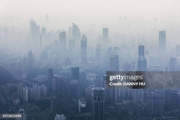 shanghai downtown in fog - smog skyline stock pictures, royalty-free photos & images